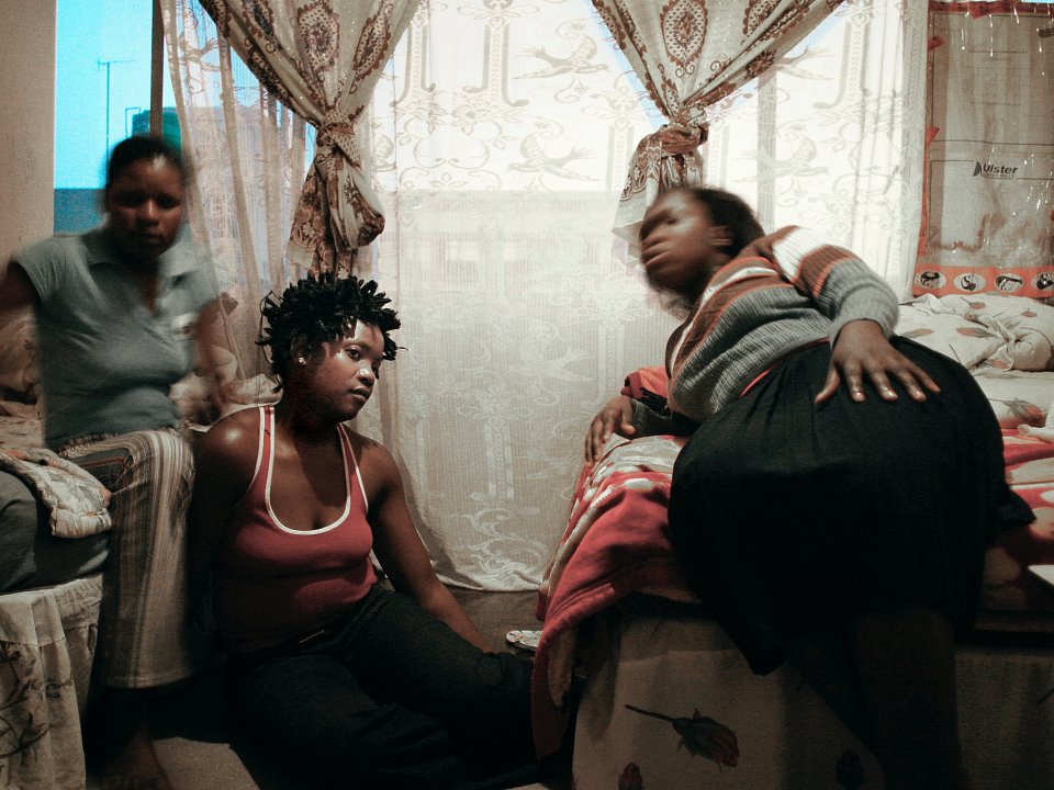 Tshililo (right) and her friends share a one-roomed apartment in Cape Agulhas, Esselen Street, Hillbrow