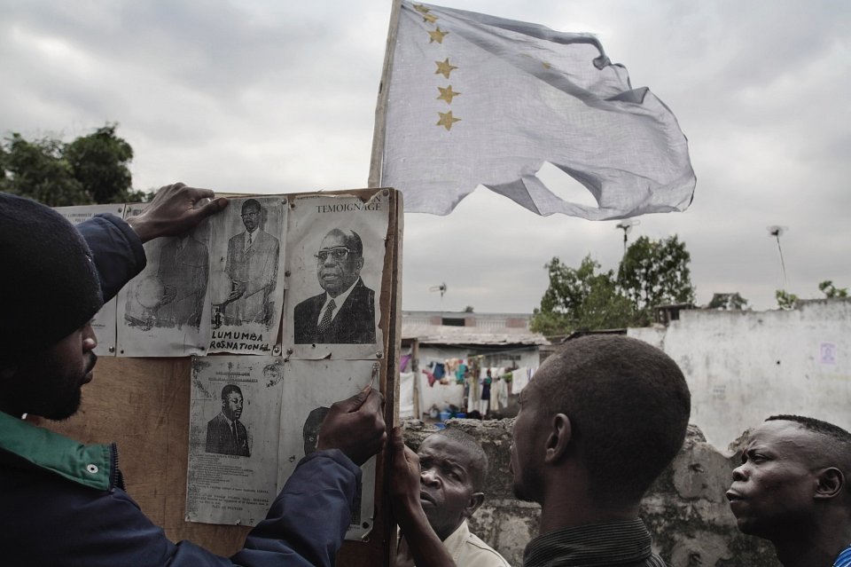 Lumumbiste Party supporters prepare for a meeting, pinning up pictures of Patrice Lumumba and their leader Antoine Gizenga, who was a deputy to Lumumba after the first elections in 1962, 2006