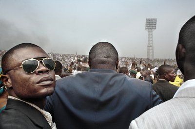 Presidential candidate Jean-Pierre Bemba enters a stadium in central Kinshasa flanked by his bodyguards, 2006