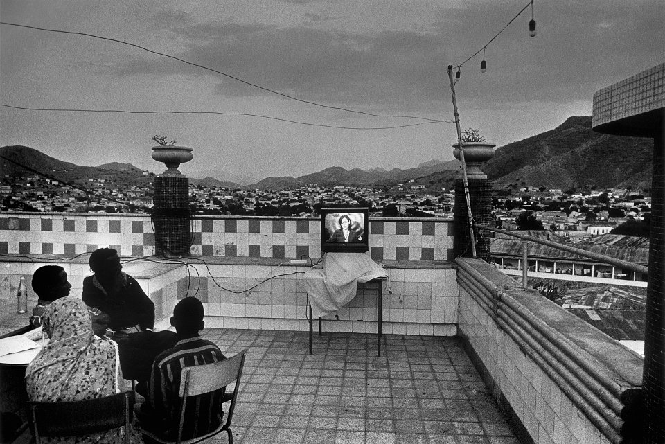 The evening television news during the Eritrea / Ethiopia war, on the rooftop of the Keren Hotel, Eritrea, 2000